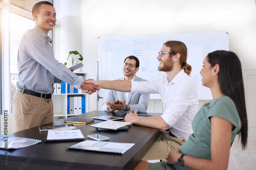 We look forward to working with you. a diverse group of businesspeople shaking hands during a meeting in the office.