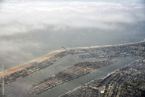 Newport beach aerial view as sea mist is building shortly after take off from John Wayne Airport