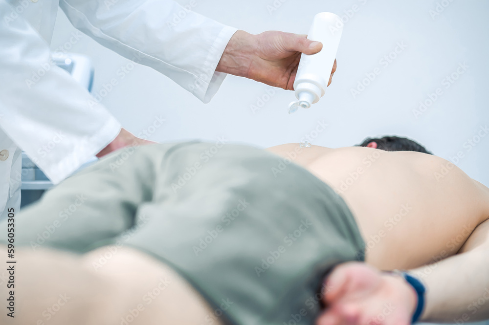 Man lying on a couch during a session of magnet therapy Man lying on a couch during a session of magnet therapy