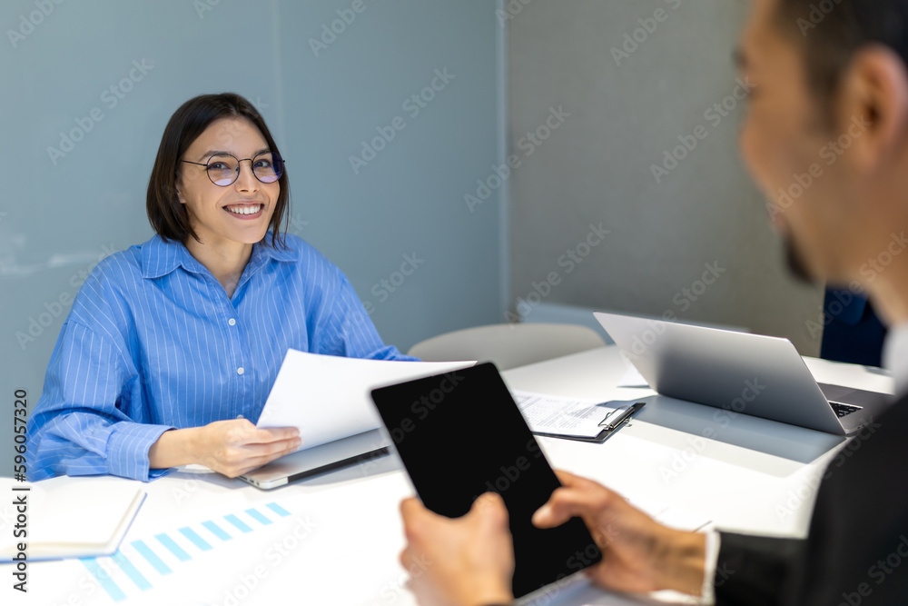 Business partners having negotiations in the office Business partners having negotiations in the office