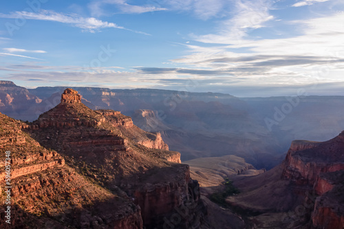 Panoramic aerial view from Bright Angel hiking trail at South Rim of Grand Canyon National Park  Arizona  USA. Vista after sunrise in summer. Colorado River weaving through valleys and rugged terrain