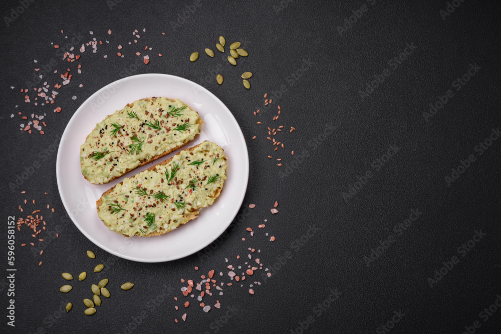 Grilled toast with avocado paste, eggs, cream cheese, salt, spices and herbs Grilled toast with avocado paste, eggs, cream cheese, salt, spices and herbs