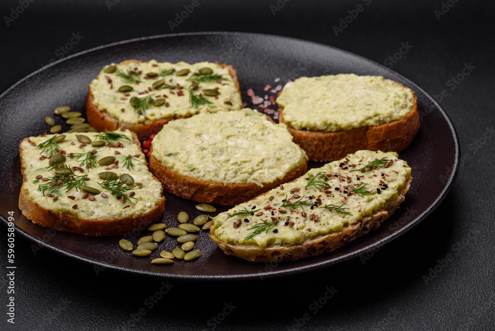 Grilled toast with avocado paste, eggs, cream cheese, salt, spices and herbs Grilled toast with avocado paste, eggs, cream cheese, salt, spices and herbs
