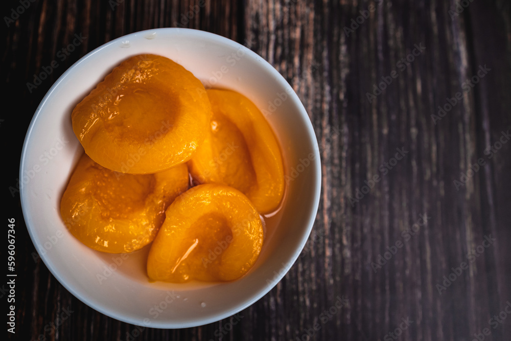Ripe and Juicy Peaches on Wooden Background