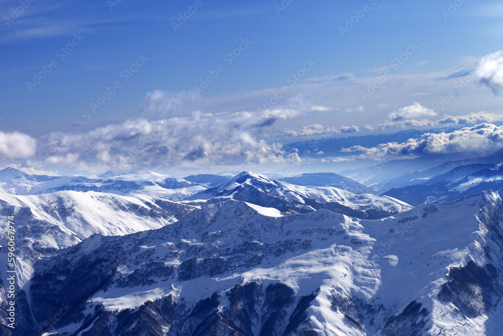 Sunlight snowy mountains
