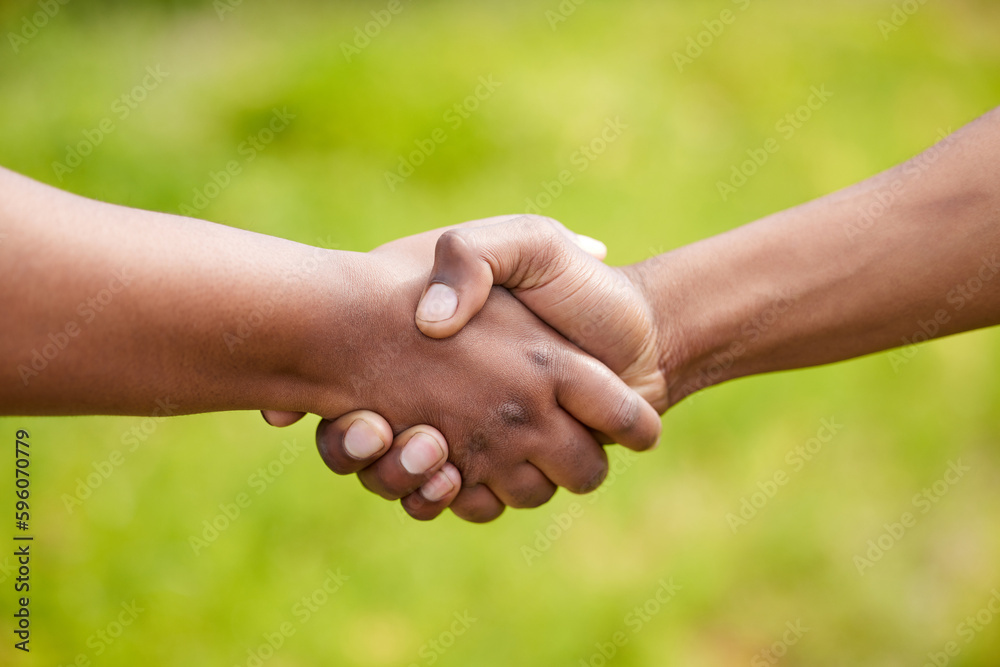 This is the start of a great partnership. two unrecognizable people shaking hands in nature. This is the start of a great partnership. two unrecognizable people shaking hands in nature.