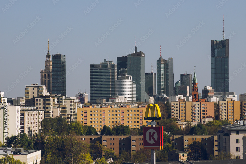 Fototapeta premium Observation deck with binoculars and a view of a modern business center with office buildings:Warsaw/Poland-22 April 2023