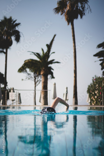 Person swimming in a pool © A. Emson