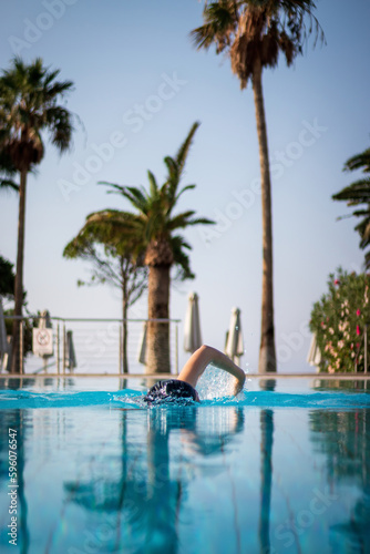 Person swimming in a pool © A. Emson