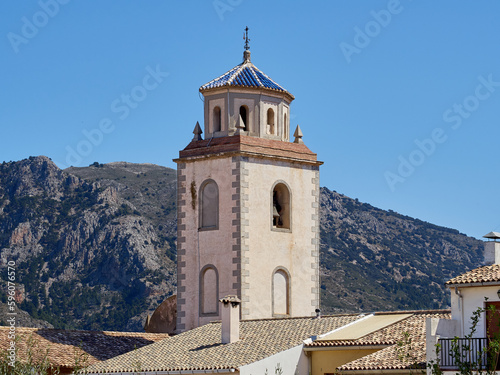 Bell tower of the church of San Vicente Mártir (Sant Vicent Martir) in Benimantell, a town and municipality located in Marina Baixa, in the province of Alicante. Valencian community, Spain photo