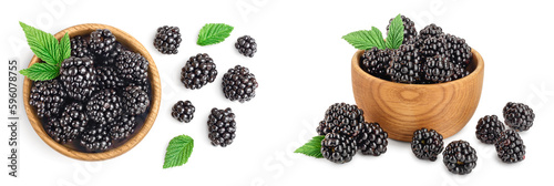 blackberry with leaf in wooden bowl isolated on a white background closeup photo