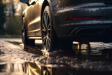 Splashes and underside of a car wheel with selective focus and blurred background. AI generated, human enhanced.