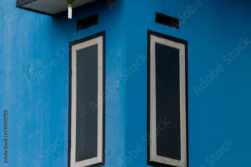 Windows on blue wall © Komodo Studios 