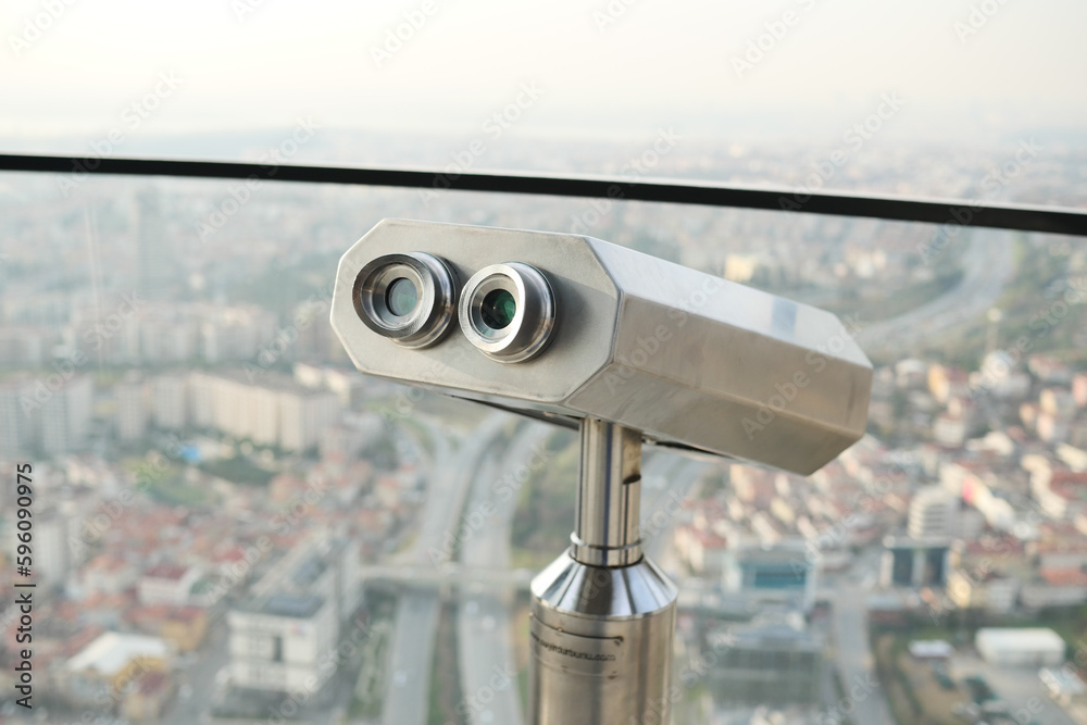 Coin-operated binoculars looking out over city , Coin-operated binoculars looking out over city ,