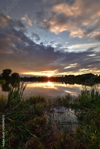 Beautiful colorful landscape by the lake in the countryside. Sunset on the Mojcza lake near Kielce  Poland.