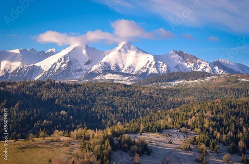 Beautiful morning spring landscape in the countryside. View of the Belianske Tatras from the village of Osturna in Slovakia.