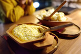 Traditional rustic treat in Montenegro is kachamak. Kachemak is a corn porridge mixed with crushed potatoes and kaymak, sheep cheese. National cuisine of Balkans