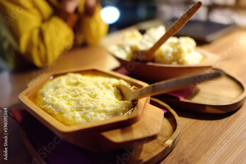 Traditional rustic treat in Montenegro is kachamak. Kachemak is a corn porridge mixed with crushed potatoes and kaymak, sheep cheese. National cuisine of Balkans photo