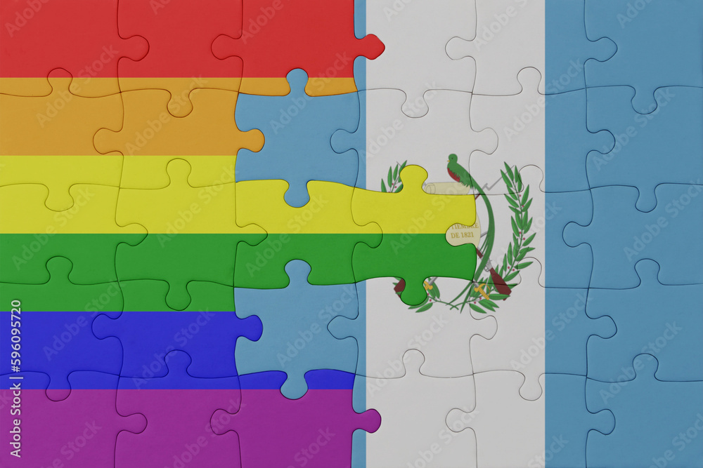puzzle with the flag of rainbow gay pride and guatemala . macro.concept. puzzle with the flag of rainbow gay pride and guatemala . macro.concept.