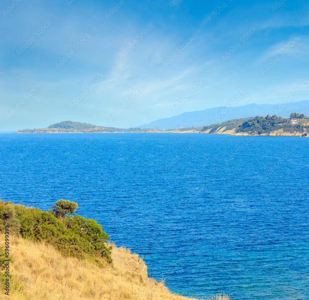 Summer Aegean Sea coast landscape (Ormos Panagias, Halkidiki, Greece).