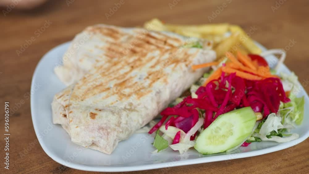 chicken warp and fresh salad on table chicken warp and fresh salad on table