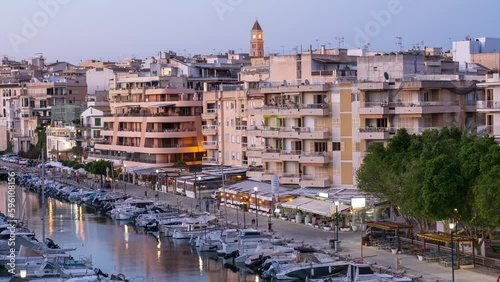 Time-lapse Shot from Day to Night in the Yacht Harbor of Porto Cristo, Mallorca, Spain photo