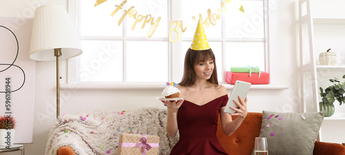 Young woman with tablet com...