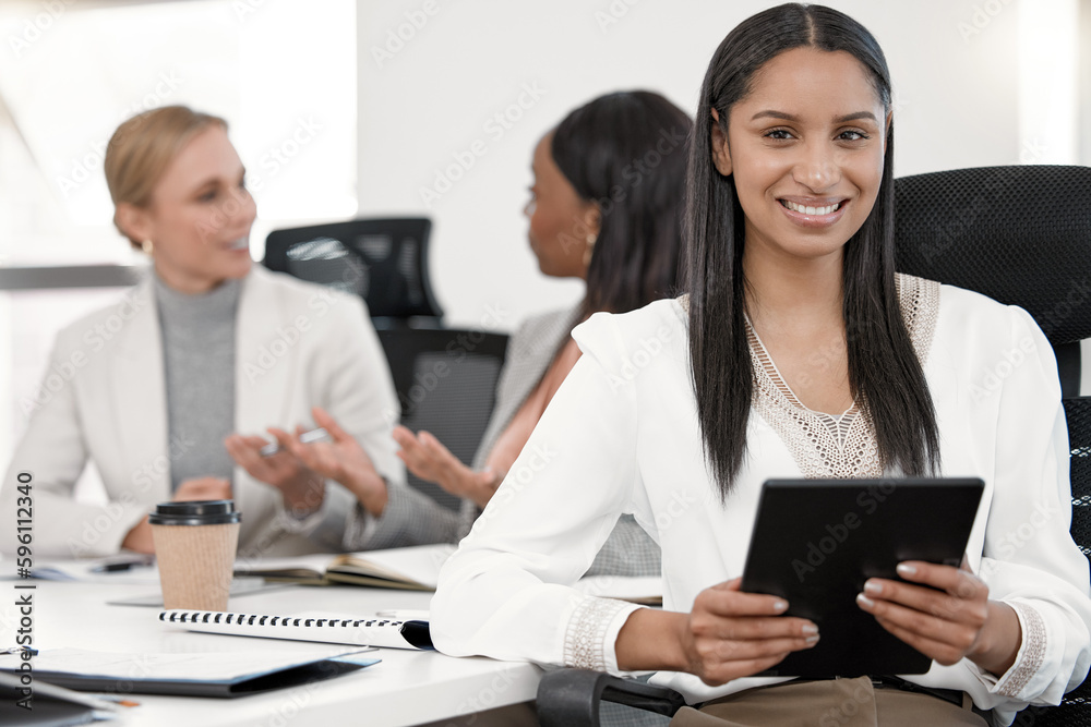 When you hand good people possibility, they do great things. a young business woman using a tablet in a meeting in a office. When you hand good people possibility, they do great things. a young business woman using a tablet in a meeting in a office.
