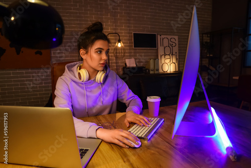 Young female programmer wor...