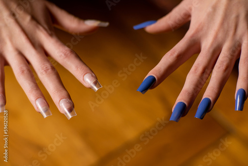 Women s manicure. A hand with finished painted nails and a hand with unpainted ones. Photos before and after.