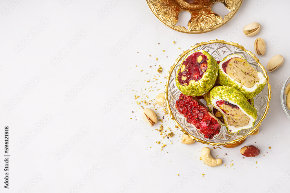 Bowl with tasty Turkish delight on light background Bowl with tasty Turkish delight on light background