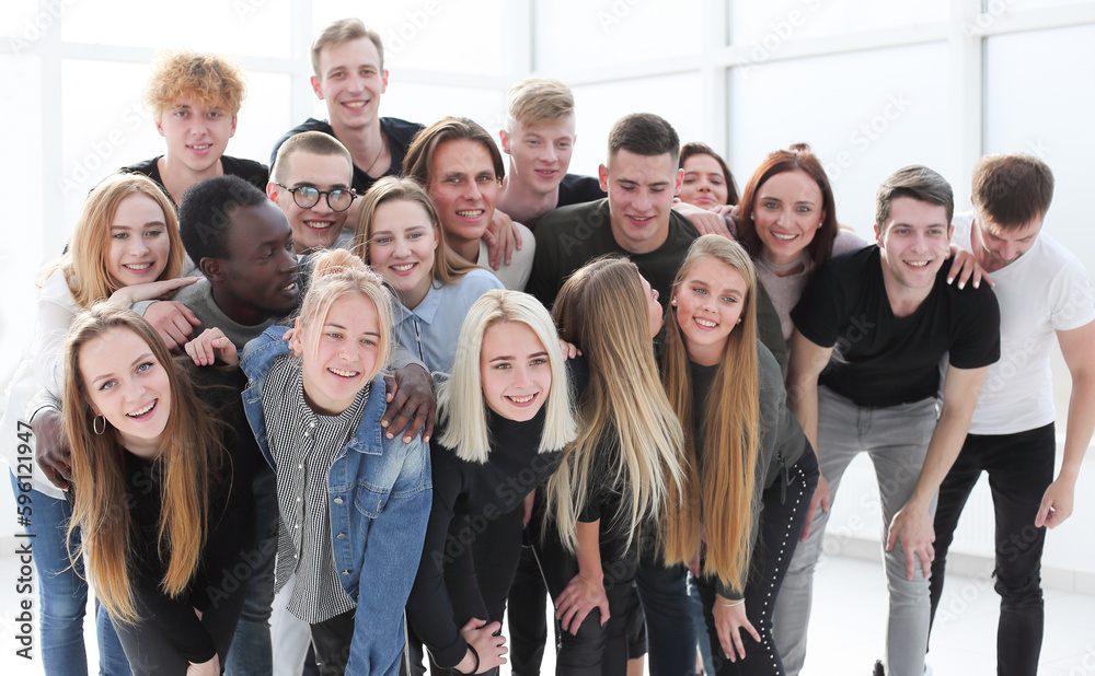 Fototapeta premium in full growth. happy young people standing together