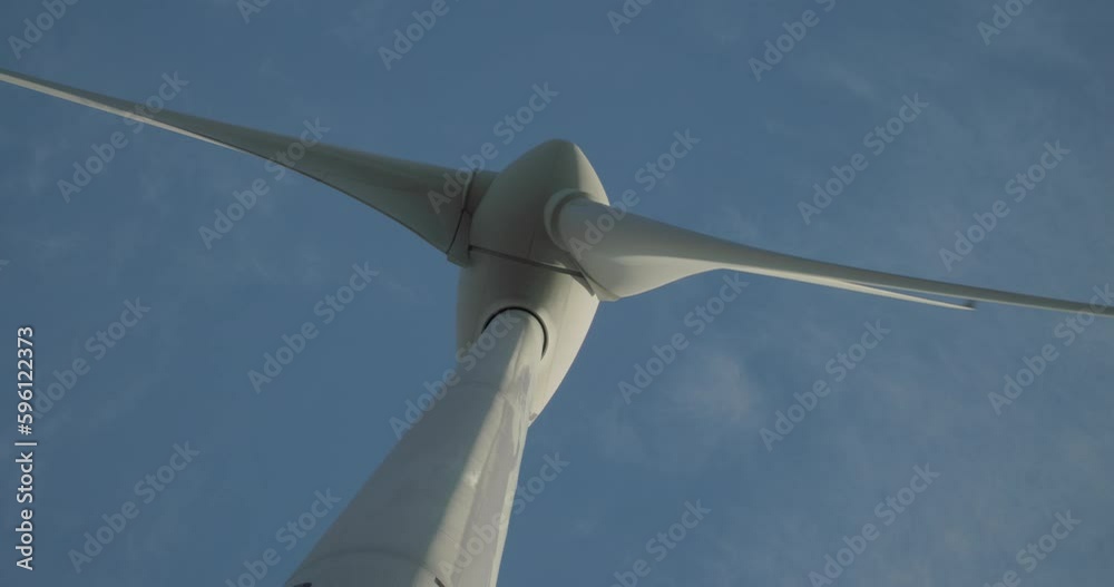 Close up of wind turbine windmill turning in a blue sky with clouds
Close up of wind turbine windmill turning in a blue sky with clouds