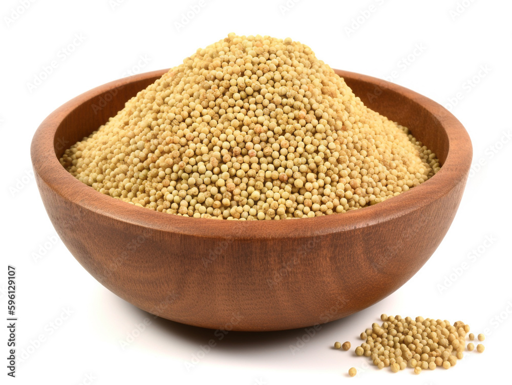 A pile of yellow mustard seeds on a white background A pile of yellow mustard seeds on a white background