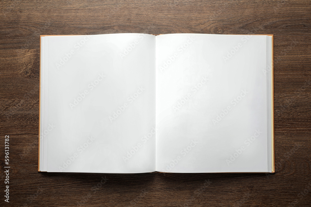 Open book on wooden table, top view Open book on wooden table, top view