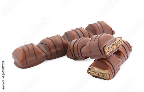 Pieces of tasty chocolate bars on white background