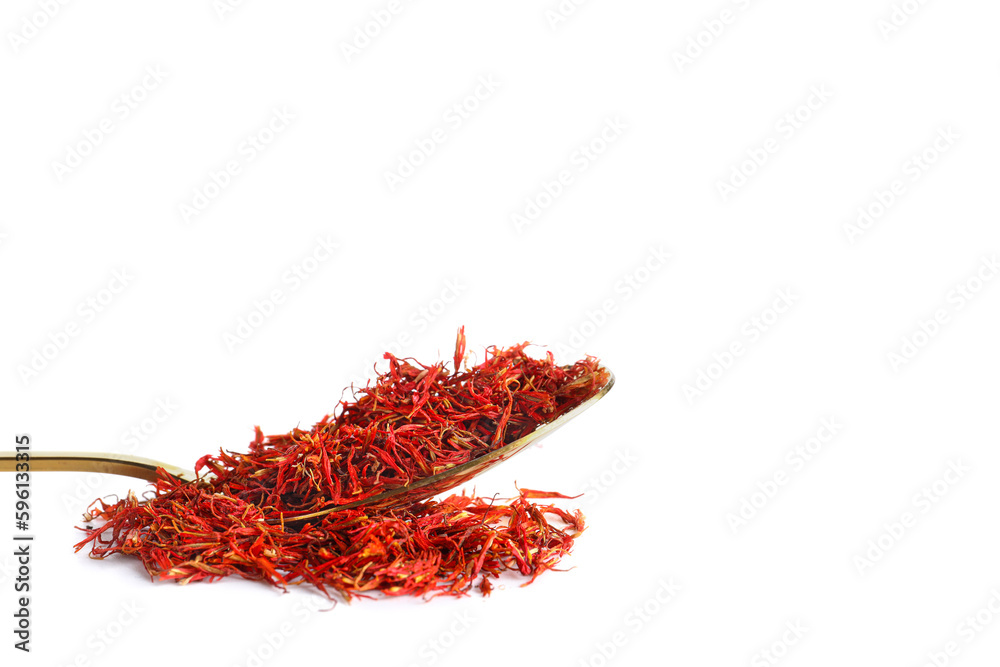Fototapeta premium Spoon with pile of saffron on white background