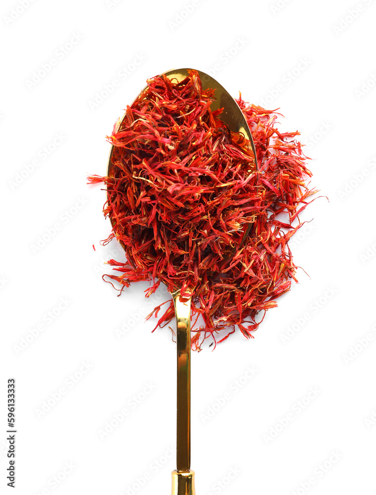 Naklejka premium Spoon with pile of saffron on white background