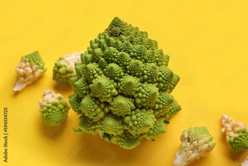 Composition with romanesco cabbage on yellow background