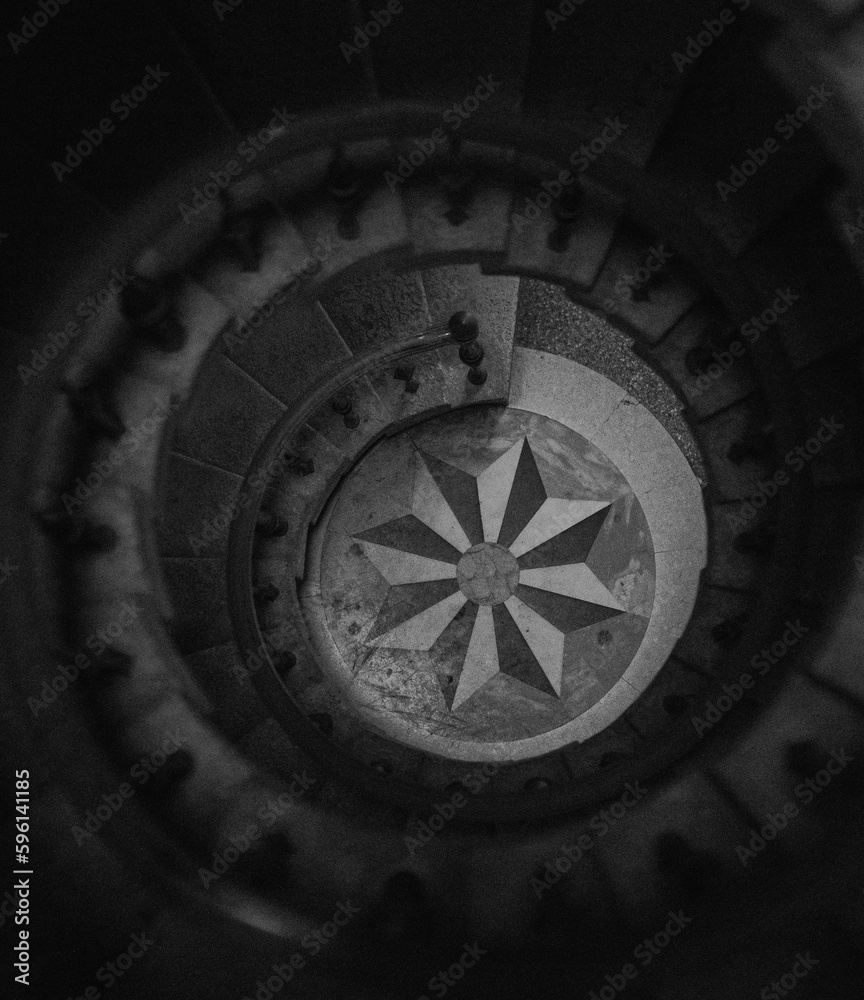 compass on a black background stairs black and white 