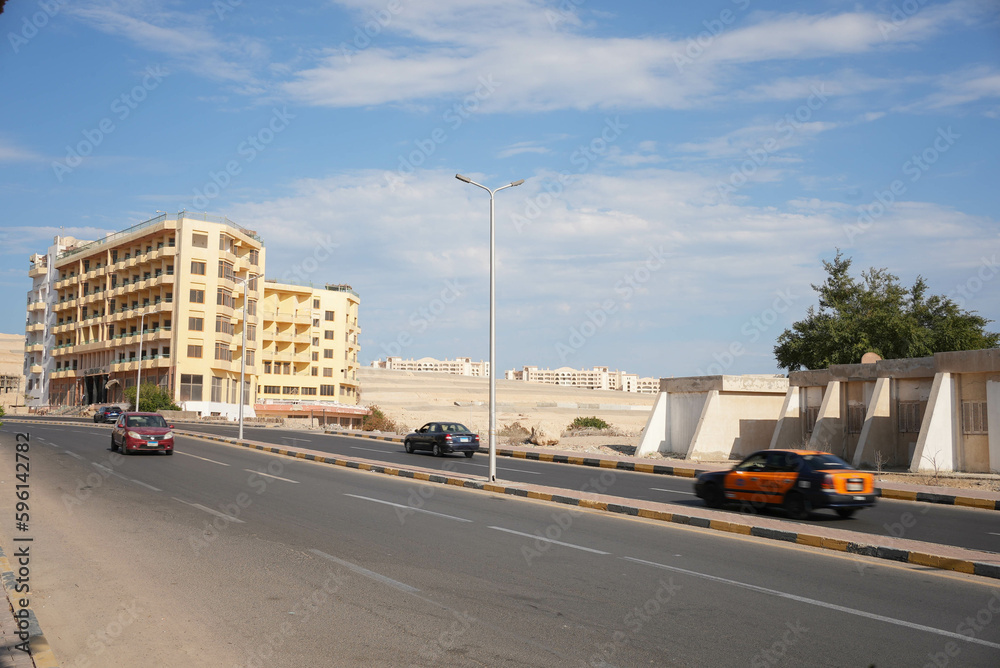 Egyptian road with cars and taxi passing