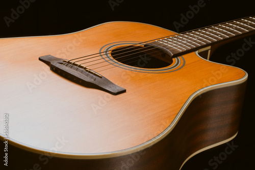 The close-up acoustic guitar