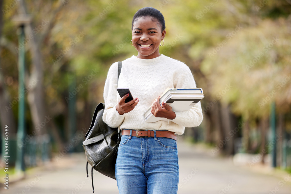 Obraz premium My campus feels like home. a young woman using a smartphone outside at college.