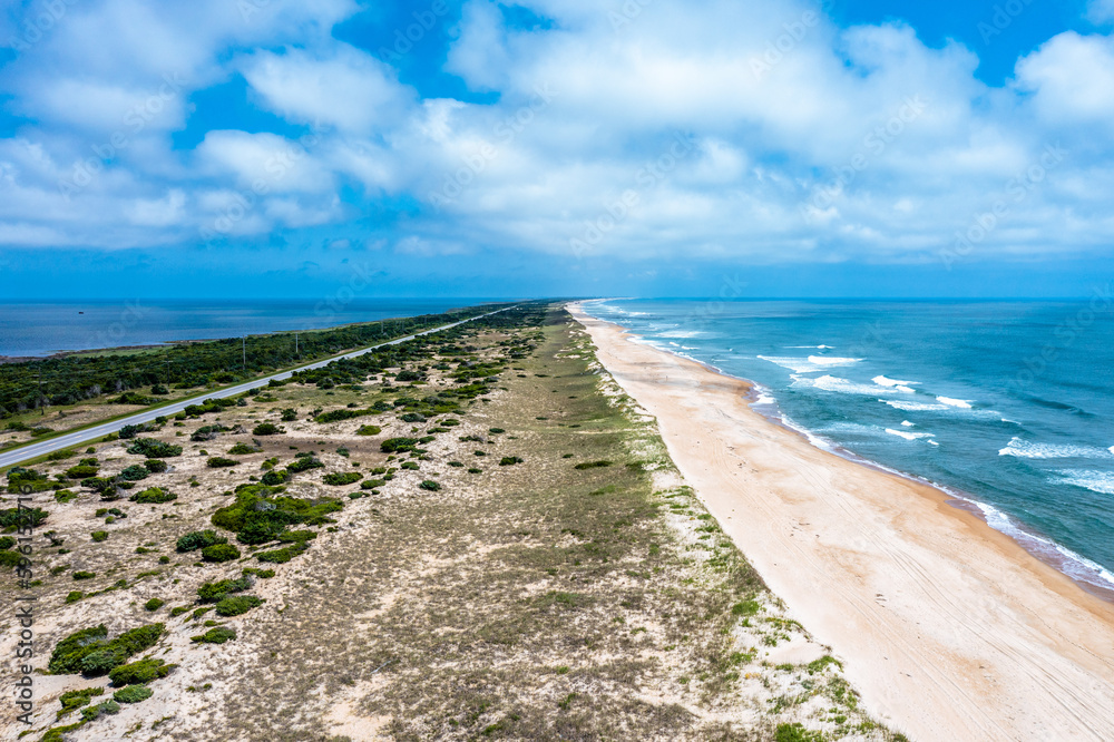 Aerial View of Empty Beach on Hatteras Island with Highway 12 in the Outer banks North Carolina