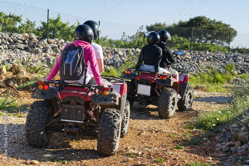 Friends driving off-road with quad bike or ATV. Group Of Friends Riding Together atv. Off Road adventure. activity
