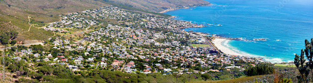 Aerial panorama photo of Cape Town. Scenic still life view over a beach Bay and the mountains in the outdoors. Blue ocean on a sunny summer day.