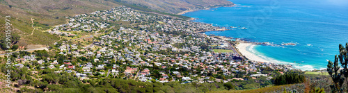 Aerial panorama photo of Cape Town. Scenic still life view over a beach Bay and the mountains in the outdoors. Blue ocean on a sunny summer day.
