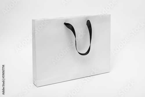 White paper bag, with black cloth handle design