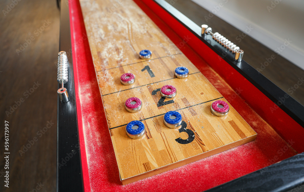 Shuffleboard is a game of precision and strategy, where players slide