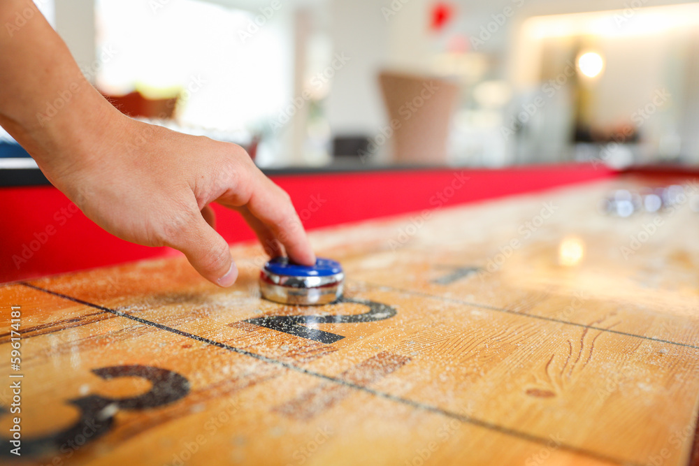 Shuffleboard is a game of precision and strategy, where players slide